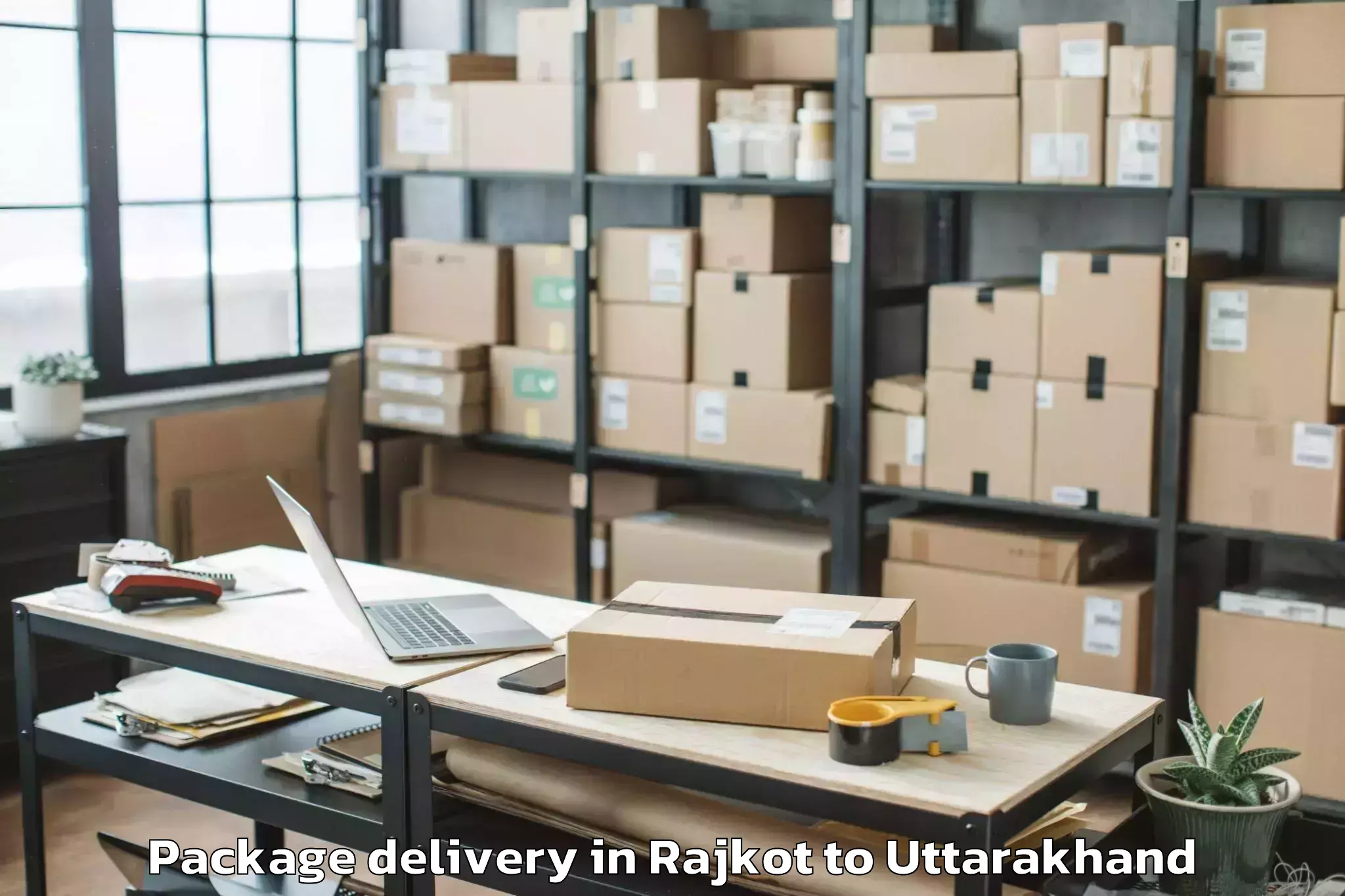 Book Rajkot to Hemwati Nandan Bahuguna Uttara Package Delivery Online